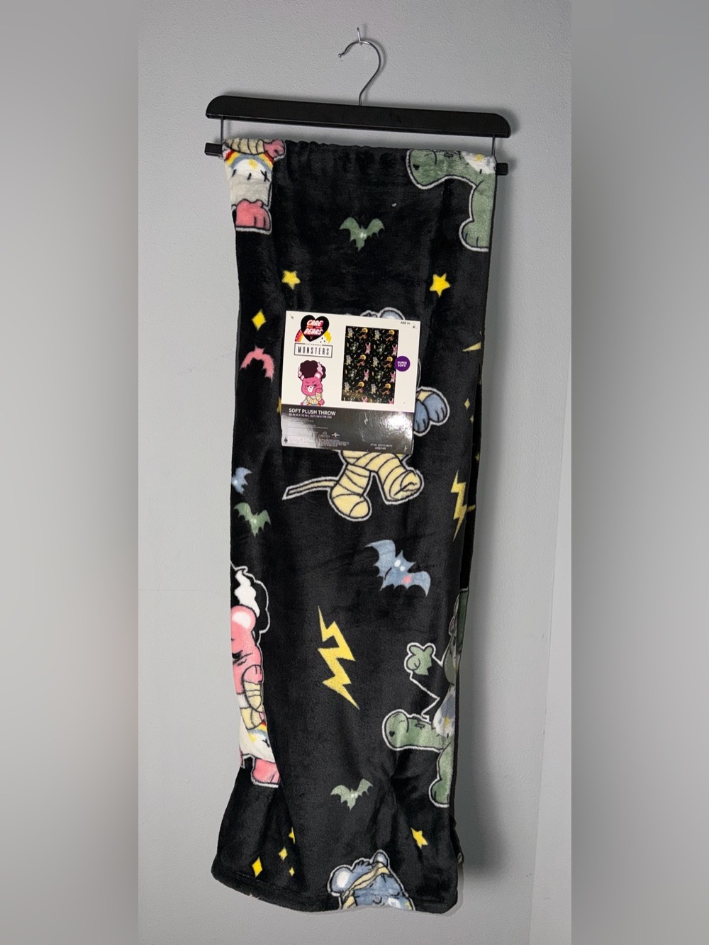 Care Bears Black Plush Throw with Multicolor Characters and Lightning